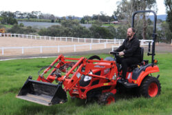 Kioti CS2610 Compact Tractor | ROPS | 25hp | Hydrostatic | Includes Loader and 4-in-1 Bucket | CS Series