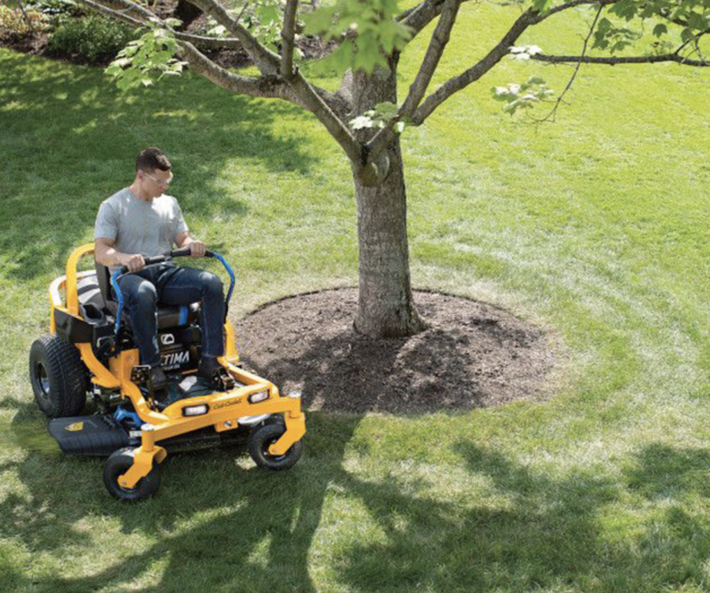 KC Equipment ride-on mower in use